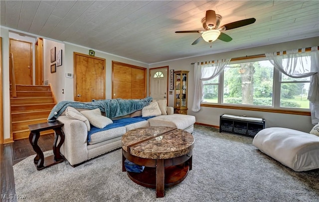 2463 NW Renner Dr NW, Dover, OH 44622 - carpeted living room featuring a ceiling fan, ornamental molding, wooden ceiling, and stairway
