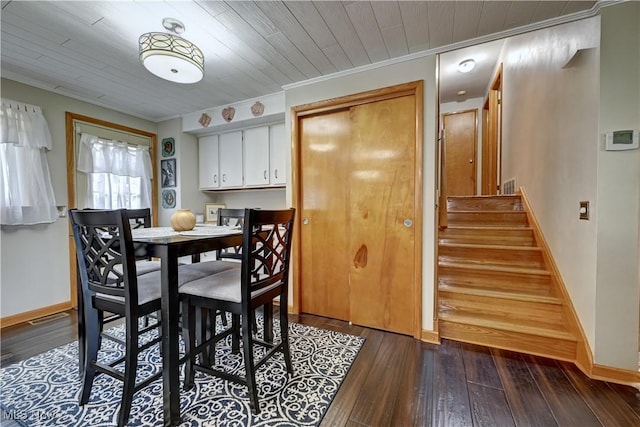 2463 NW Renner Dr NW, Dover, OH 44622 - dining space with dark wood finished floors, stairway, and ornamental molding