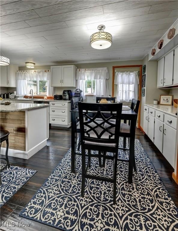 2463 NW Renner Dr NW, Dover, OH 44622 - dining room with dark wood-type flooring