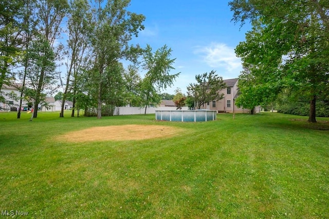 1005 Penn Ct, Grafton, OH 44044 - view of grassy yard featuring a covered pool