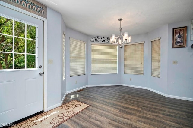 1005 Penn Ct, Grafton, OH 44044 - unfurnished dining area with a chandelier, dark wood-style floors, and plenty of natural light