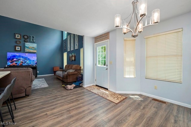 1005 Penn Ct, Grafton, OH 44044 - foyer with wood finished floors and a chandelier