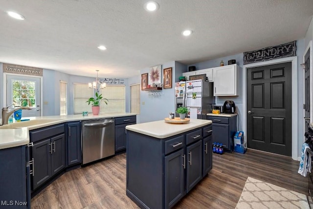 1005 Penn Ct, Grafton, OH 44044 - kitchen with stainless steel appliances, light countertops, dark wood-style flooring, a chandelier, and recessed lighting