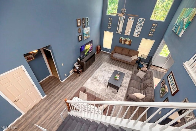1005 Penn Ct, Grafton, OH 44044 - living room with a towering ceiling, healthy amount of natural light, wood finished floors, and a ceiling fan