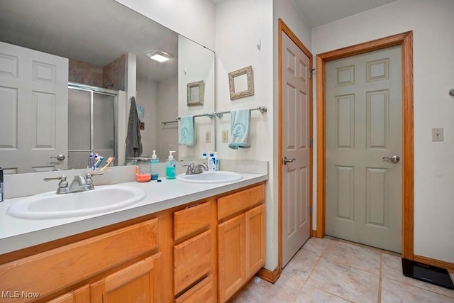 1005 Penn Ct, Grafton, OH 44044 - full bathroom with a stall shower, double vanity, and tile patterned floors