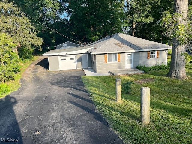 3402 Easton Rd, Norton, OH 44203 - ranch-style home featuring an attached garage, driveway, and a front yard