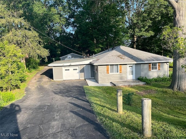 3402 Easton Rd, Norton, OH 44203 - ranch-style home featuring an attached garage, driveway, and a front lawn