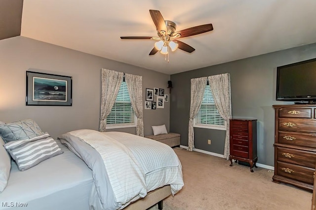 101 Middle Post Pt, Chardon, OH 44024 - bedroom featuring multiple windows, light carpet, and a ceiling fan