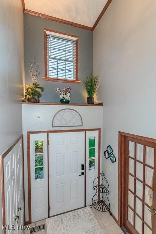101 Middle Post Pt, Chardon, OH 44024 - foyer entrance featuring tile patterned flooring and ornamental molding
