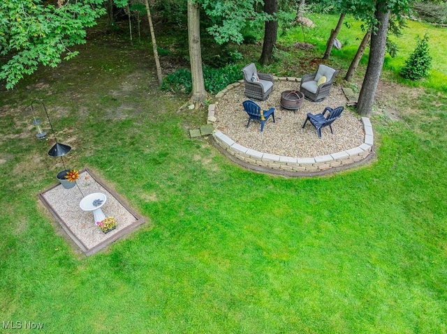 101 Middle Post Pt, Chardon, OH 44024 - view of green lawn featuring a fire pit