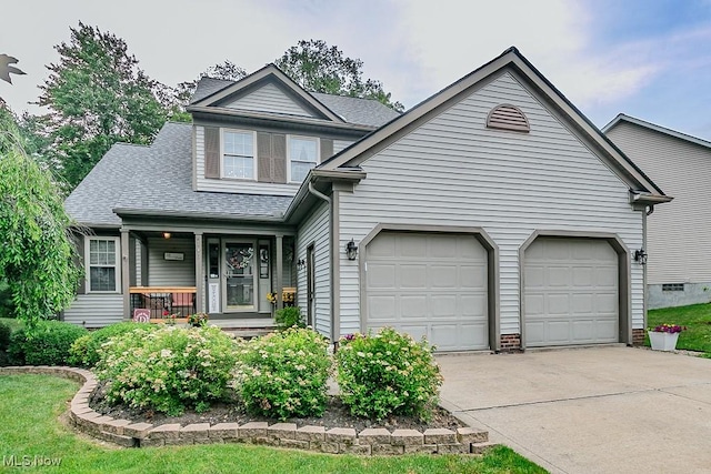 101 Middle Post Pt, Chardon, OH 44024 - view of front of house featuring concrete driveway, a porch, an attached garage, and a shingled roof