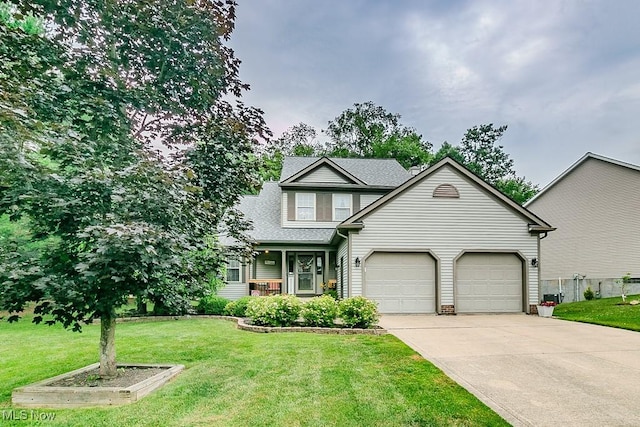 101 Middle Post Pt, Chardon, OH 44024 - view of front facade with an attached garage, driveway, a front yard, and roof with shingles