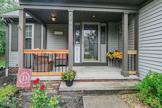 101 Middle Post Pt, Chardon, OH 44024 - view of exterior entry with covered porch and a security system