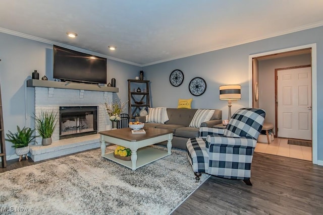 101 Middle Post Pt, Chardon, OH 44024 - living area with crown molding, wood finished floors, a brick fireplace, and recessed lighting