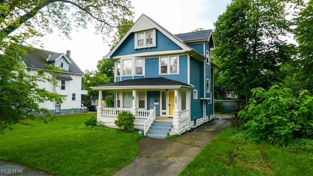 9907 Kempton Ave, Cleveland, OH 44108 - traditional style home featuring a porch and a front yard