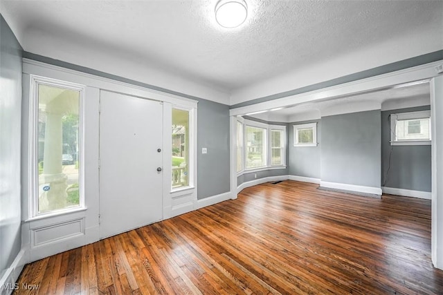 9907 Kempton Ave, Cleveland, OH 44108 - entrance foyer featuring hardwood / wood-style flooring, a textured ceiling, and plenty of natural light