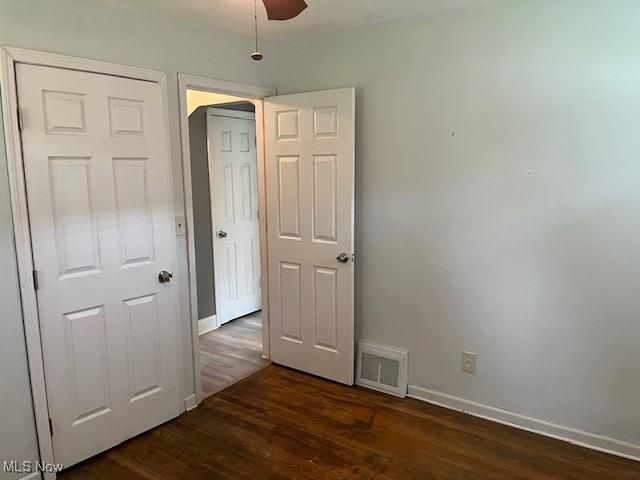 5559 Fitch Rd, North Olmsted, OH 44070 - unfurnished room featuring dark wood finished floors and ceiling fan