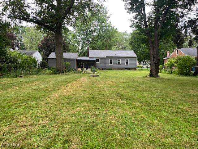 5559 Fitch Rd, North Olmsted, OH 44070 - view of grassy yard featuring view of scattered trees