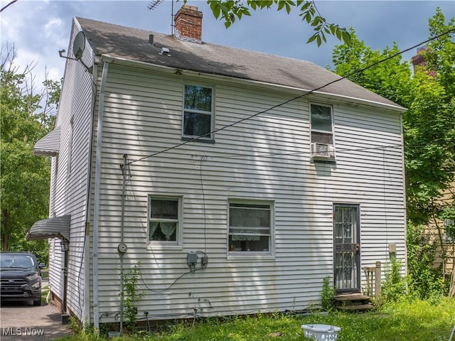 931 Yellowstone Rd, Cleveland, OH 44121 - rear view of house with a chimney