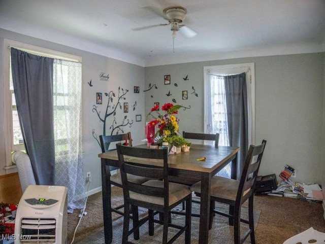 931 Yellowstone Rd, Cleveland, OH 44121 - carpeted dining area with ceiling fan