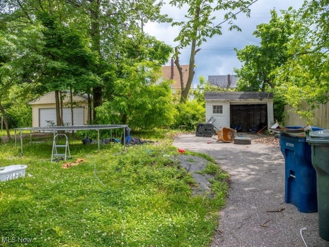 931 Yellowstone Rd, Cleveland, OH 44121 - view of yard featuring a shed and a trampoline