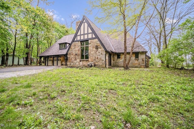 38038 Ridge Rd, Willoughby, OH 44094 - tudor house featuring stone siding and asphalt driveway
