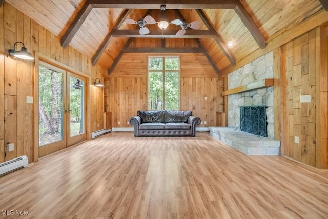 38038 Ridge Rd, Willoughby, OH 44094 - unfurnished living room featuring wood ceiling, wood finished floors, a stone fireplace, wood walls, and a baseboard radiator