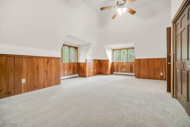 38038 Ridge Rd, Willoughby, OH 44094 - bonus room featuring wainscoting, baseboard heating, wooden walls, lofted ceiling, and ceiling fan