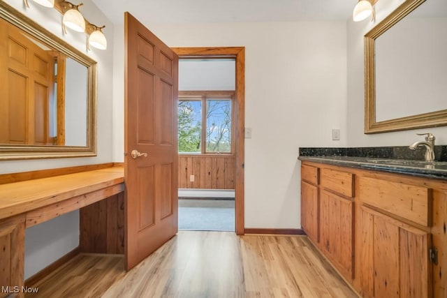 38038 Ridge Rd, Willoughby, OH 44094 - bathroom featuring a baseboard radiator, wood finished floors, and vanity