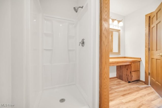 38038 Ridge Rd, Willoughby, OH 44094 - bathroom with a shower, wood finished floors, and vanity