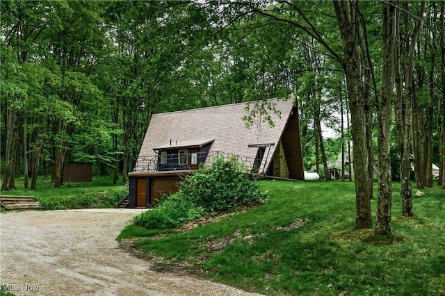 2269 N Fox N Rd, Hubbard, OH 44425 - a-frame style home with driveway, an attached garage, and a front lawn