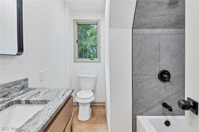2269 N Fox N Rd, Hubbard, OH 44425 - bathroom featuring vanity, wood finished floors, and shower / bathtub combination