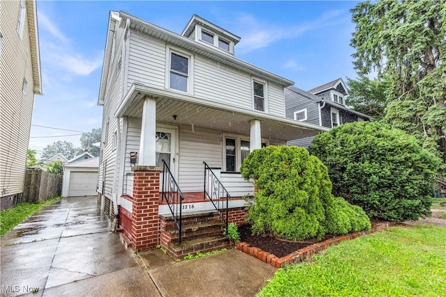 1716 Ardoyne Ave, Cleveland, OH 44109 - american foursquare style home featuring covered porch, an outbuilding, and a detached garage
