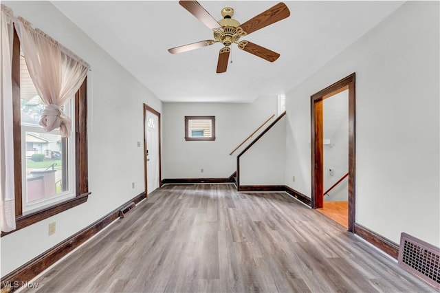 1716 Ardoyne Ave, Cleveland, OH 44109 - unfurnished living room featuring wood finished floors and a ceiling fan