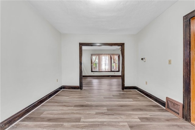 1716 Ardoyne Ave, Cleveland, OH 44109 - unfurnished room with wood finished floors and a textured ceiling