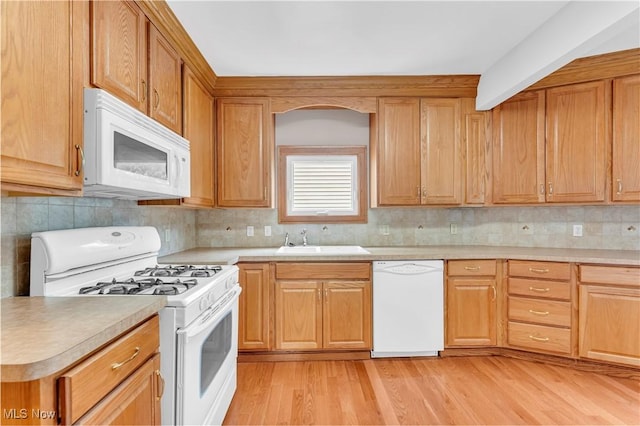 1716 Ardoyne Ave, Cleveland, OH 44109 - kitchen with white appliances, light countertops, light wood finished floors, and backsplash