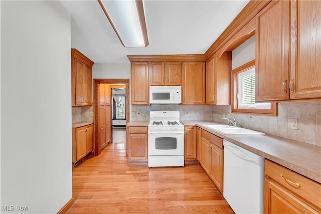 1716 Ardoyne Ave, Cleveland, OH 44109 - kitchen with white appliances, light wood-style flooring, tasteful backsplash, and light countertops