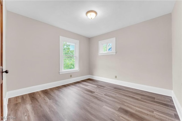 1716 Ardoyne Ave, Cleveland, OH 44109 - spare room featuring wood finished floors and baseboards