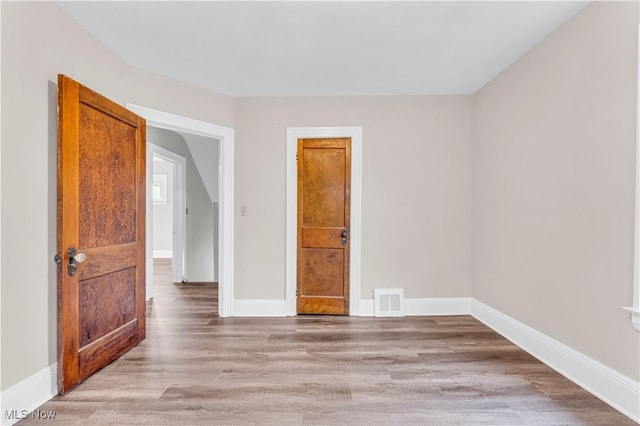 1716 Ardoyne Ave, Cleveland, OH 44109 - unfurnished room featuring light wood finished floors and baseboards