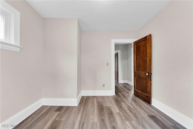 1716 Ardoyne Ave, Cleveland, OH 44109 - unfurnished room featuring wood finished floors and baseboards