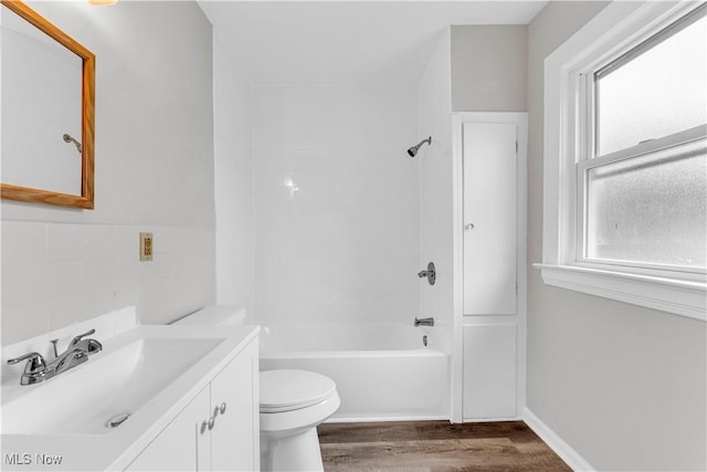 1716 Ardoyne Ave, Cleveland, OH 44109 - bathroom with vanity, wood finished floors, and bathing tub / shower combination