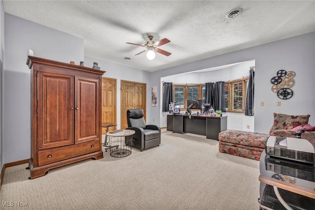 6869 Cliffside Dr, Vermilion, OH 44089 - sitting room featuring carpet floors, ceiling fan, a desk, and a textured ceiling