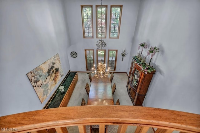 6869 Cliffside Dr, Vermilion, OH 44089 - carpeted foyer entrance featuring a chandelier and a high ceiling