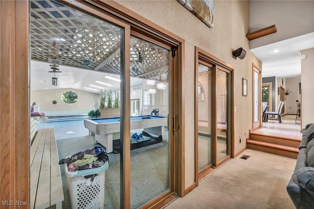 6869 Cliffside Dr, Vermilion, OH 44089 - doorway with carpet flooring and baseboards