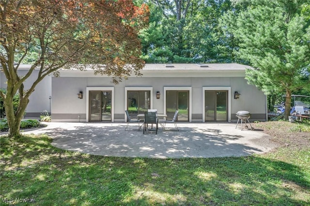 6869 Cliffside Dr, Vermilion, OH 44089 - back of property with a patio and stucco siding