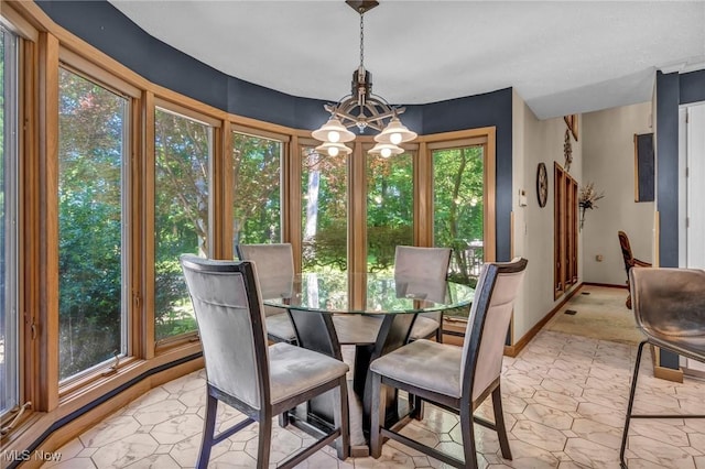 6869 Cliffside Dr, Vermilion, OH 44089 - dining room with a chandelier and baseboards