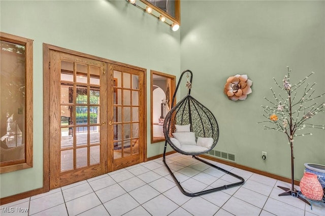 6869 Cliffside Dr, Vermilion, OH 44089 - tiled entryway featuring french doors and a towering ceiling