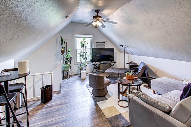 1289 W 115th St, Cleveland, OH 44102 - living room featuring a textured ceiling, a ceiling fan, vaulted ceiling, and hardwood / wood-style floors