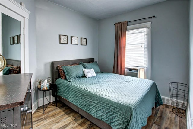 1289 W 115th St, Cleveland, OH 44102 - bedroom featuring wood finished floors and cooling unit