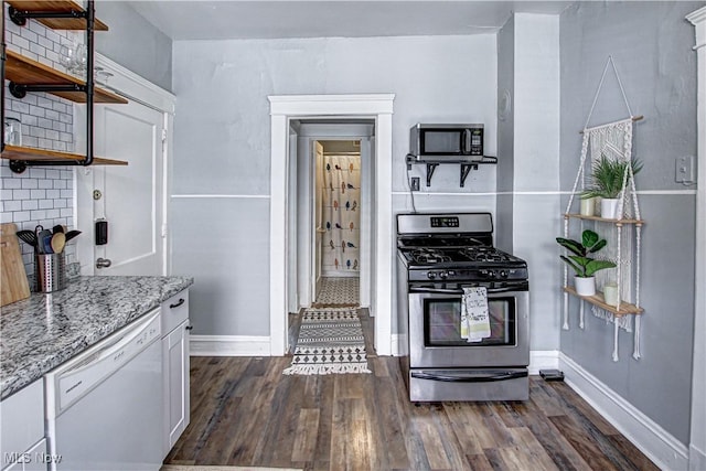 1289 W 115th St, Cleveland, OH 44102 - kitchen with stainless steel appliances, dark wood-type flooring, light stone countertops, and open shelves